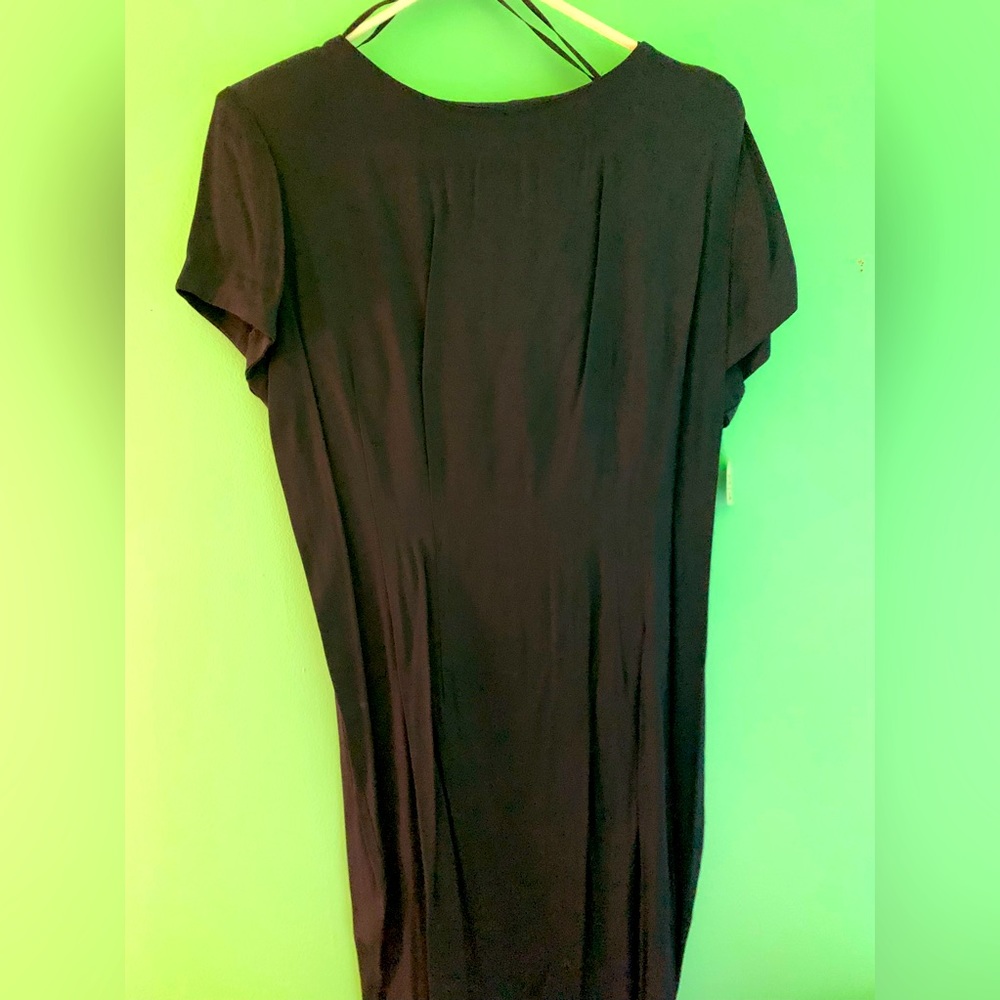 Black  short low black dress with white chiffon drape in back.